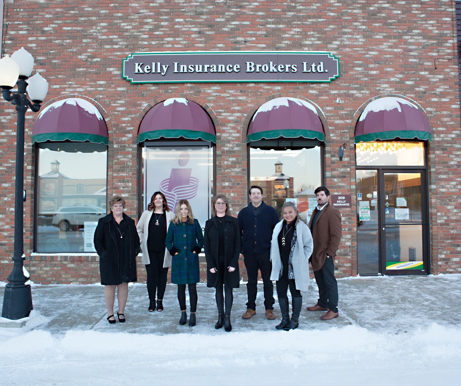 Snap front of the office with team members